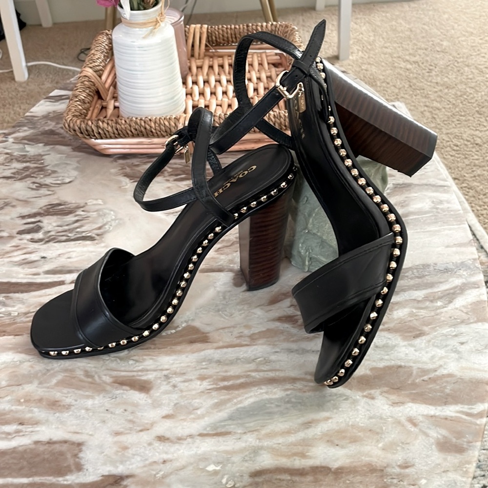 Coach Iconic “go with all” black heels with grommet detail